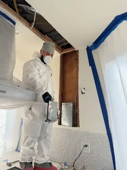 Containment plastic and protective gear during water damage removal in South Gate